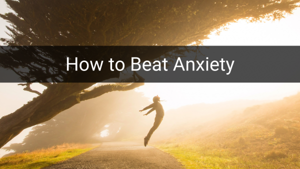 A person free from anxiety and jumping under a tree